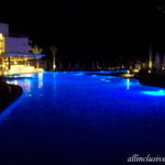 Dreams Playa Mujeres night view of the beachfront pool
