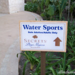 Guests can use the water sports equipment next door at Secrets resort Dreams Playa Mujeres signage