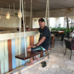 Bar with swing seats at Las Playas restaurant Hotel Xcaret Mexico Las Playas restaurant
