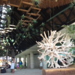 At the top of the stairs entering the lobby Hotel Xcaret Mexico lobby entrance