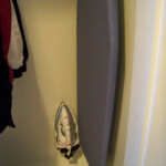 Iron and ironing board in the closet