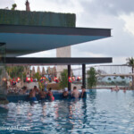 Main infinity pool's swim-up bar at dusk Hotel Xcaret Mexico main pool's swim-up bar