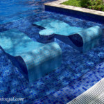 Tiled pool loungers at the Beach resort adults-only pool Barcelo Maya Beach adults-only pool