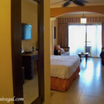 Full length mirror on the wall in the Jr. Suite bedroom Barcelo Maya Palace Jr. Suite bedroom