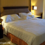 Comfortable bed Barcelo Maya Palace Jr. Suite bedroom