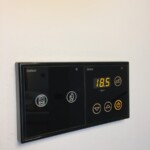 Thermostat, maid request, and "do not bother" controls in the living room TRS Coral Hotel Loft Suite