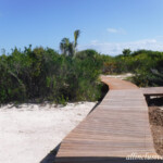 Wooden pathways will take you to the beach or between beachside buildings Grand Palladium Costa Mujeres beach paths