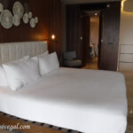 Loft Suite bedroom with adjoining full bathroom. Doors into the bathroom can be closed. TRS Coral Hotel bedroom