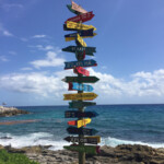 Touristy signs by the natural pools Xcaret Park