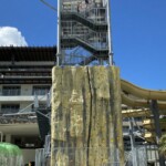 Rock climbing wall and the Rollglider entrance platform behind it