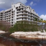Mangrove runoff on the north side of the property. Construction shell of the Senator next door